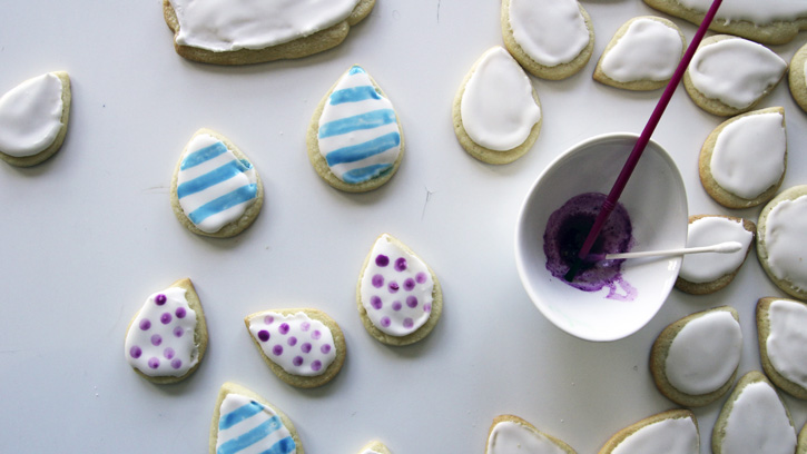 painting with colors on frosted cookies