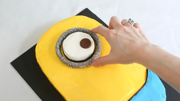 silver ring placed on cake