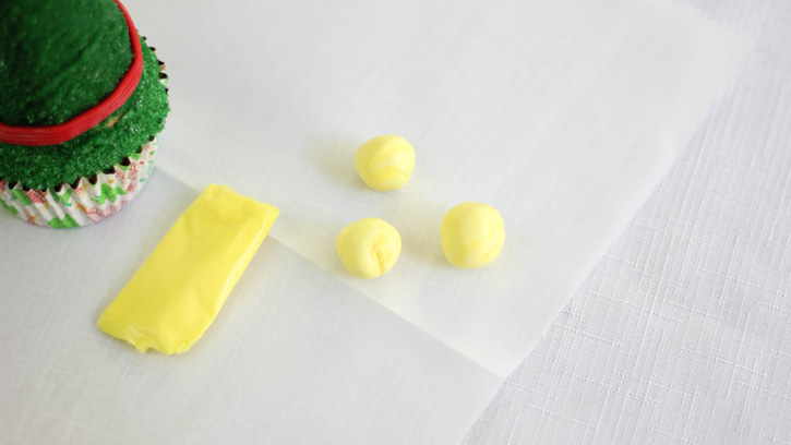 cutting and rolling yellow taffy into balls