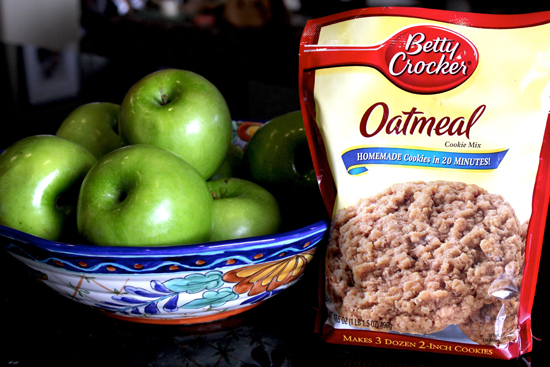 bowl of green apples and a bag of Oatmeal Cookie mix
