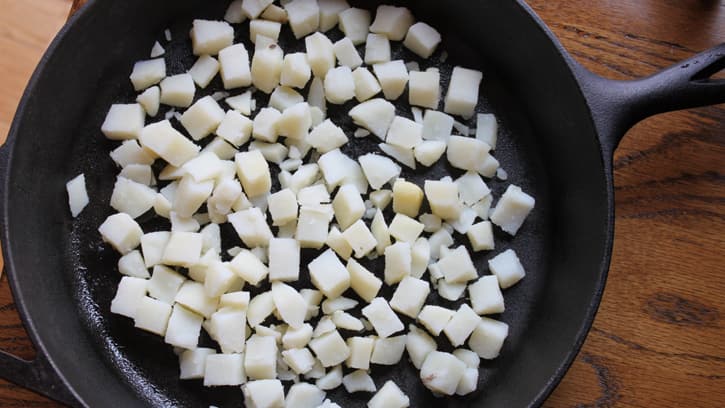 diced potatoes in skillet