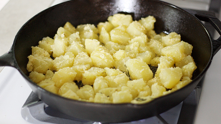 cooking potatoes in skillet