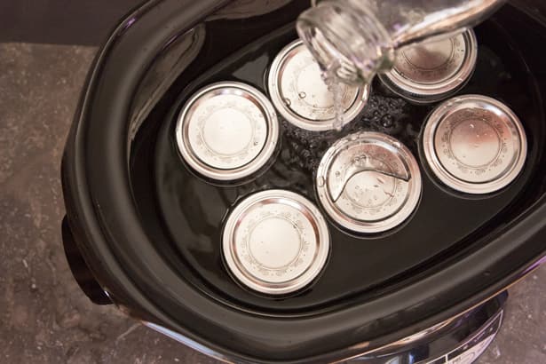 covered jars in slow cooker