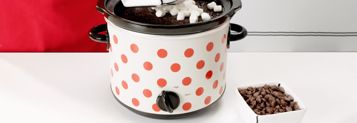 Pour mini marshmallows into a slow cooker, a bowl of chocolate chips