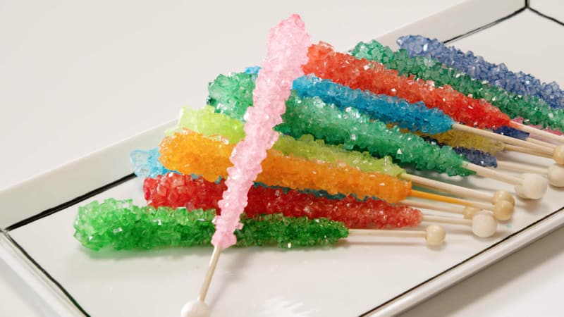 Colorful rock candy on wooden sticks