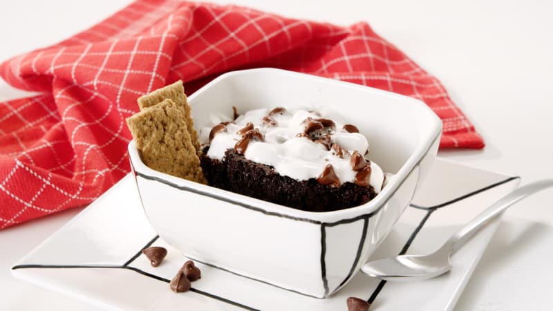 Slow cooker s'mores cake in a dish, with red towel 