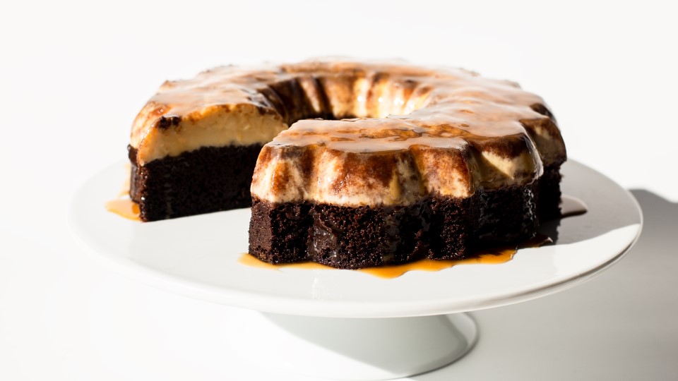 Image of Chocoflan on a white cakestand.