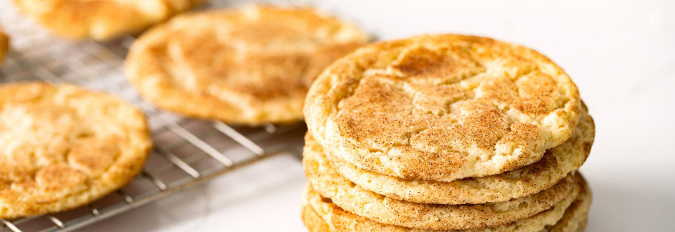 Image of Snicker Doodle cookies on a white countertop.
