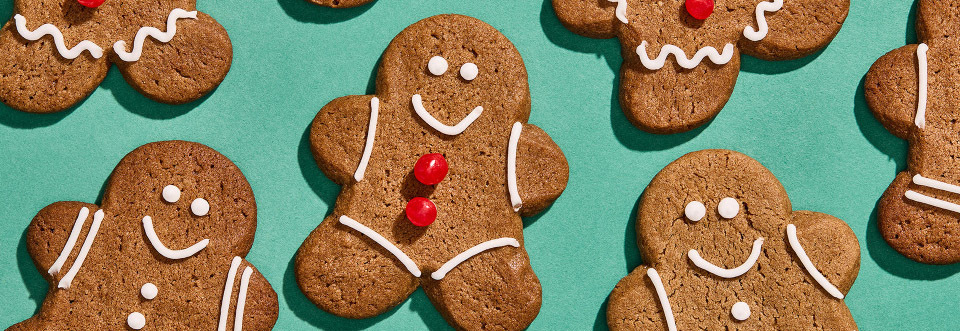 Top down image of Gingerbread Man Cookies on a green background