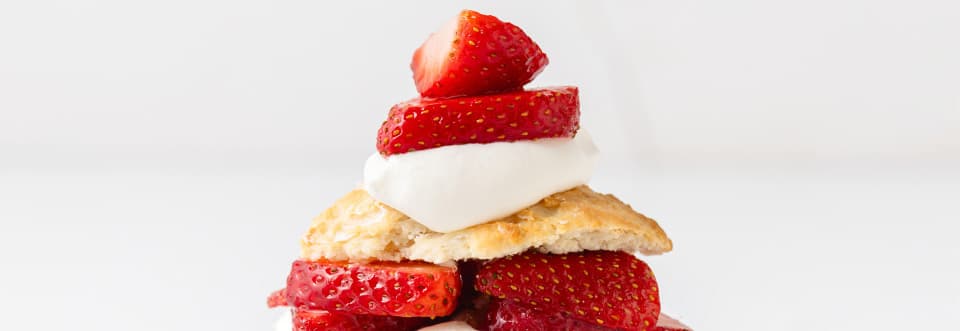 Straight on view of Strawberry Shortcake with white background. 