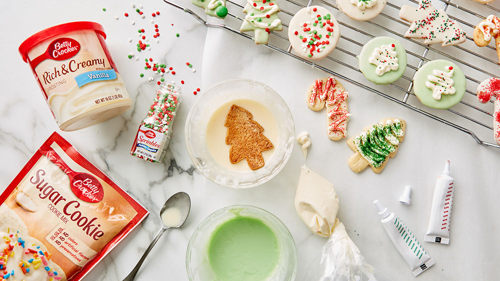 Christmas cookie decorating scene with a homemade piping bag