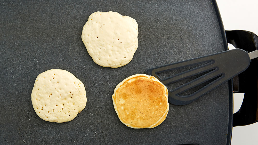cooking pancakes on griddle