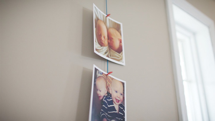 baby photos clipped to to strung-up line