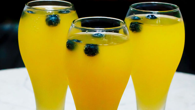 Mango-Blueberry Champagne Cocktail