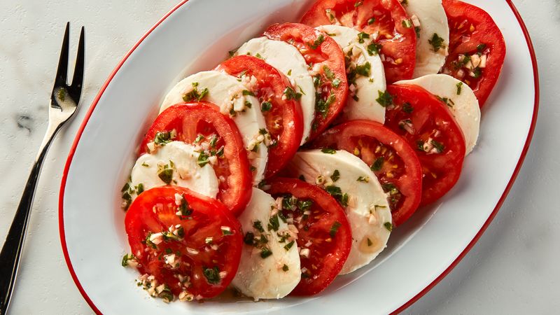 plate of fresh garlic-basil tomatoes and mozzarella 
