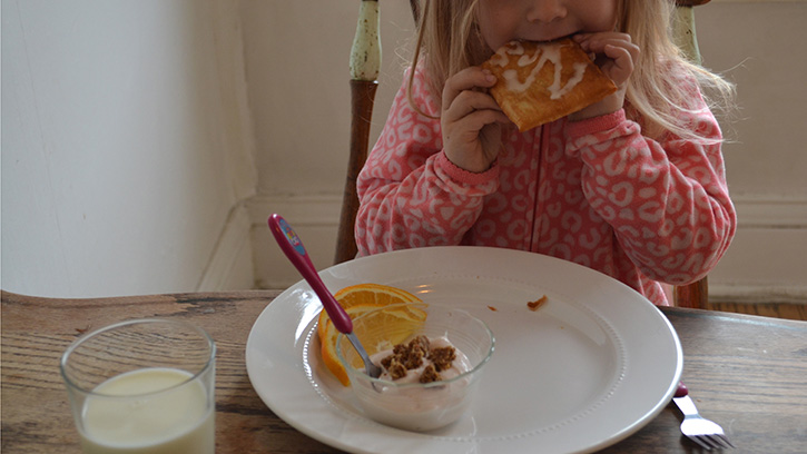 child eating toaster strudel for breakfast