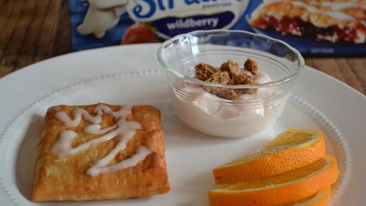 toaster strudel, yogurt and orange slices for breakfast