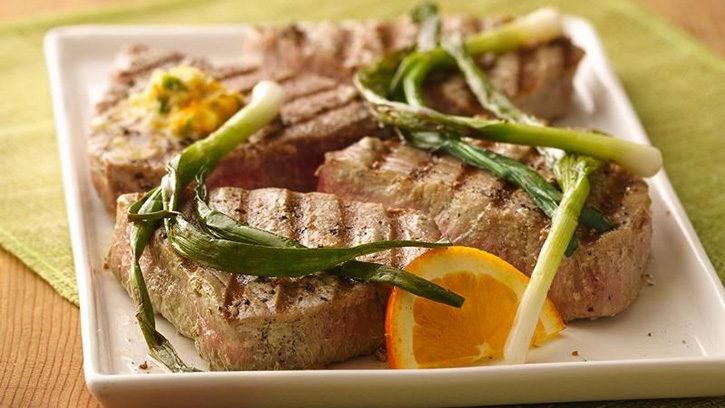 grilled tuna steaks with green onions and orange butter