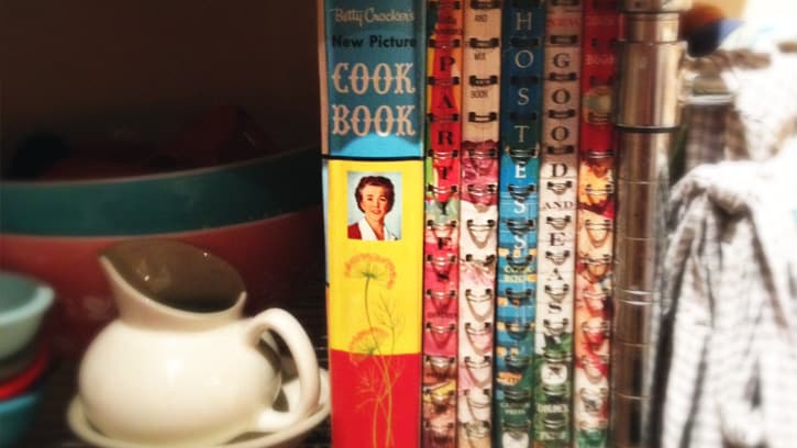 vintage Betty Crocker cookbooks on book shelf