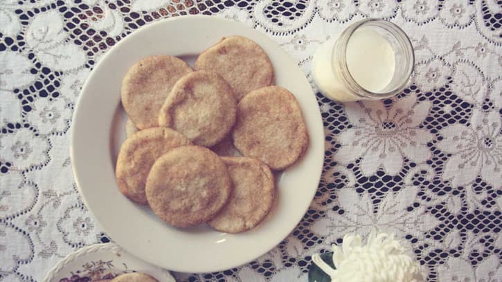 snickerdoodle cookies on a table with milk