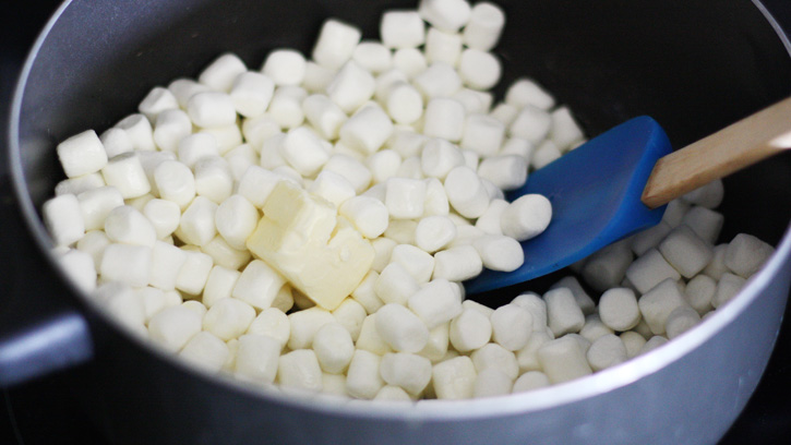 melting marshmallows and butter in saucepan