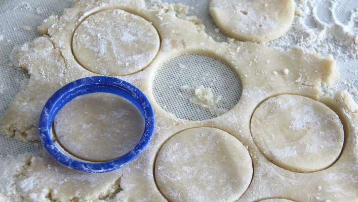 cutting out circles of dough