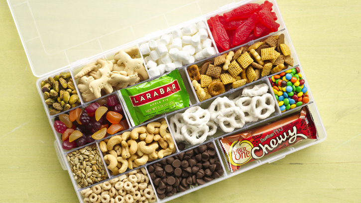 plastic container with compartments full of snacks