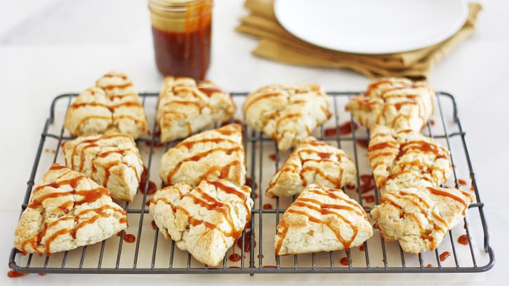 scones drizzled with caramel sauce