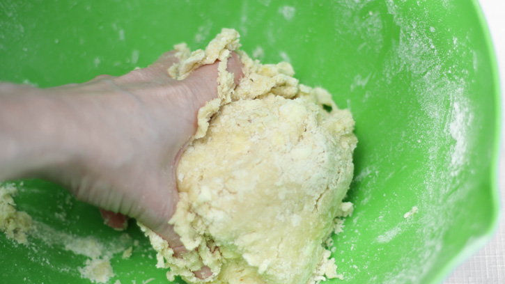 mixing dough with hand
