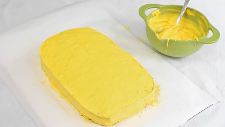 cake frosted with bright yellow frosting