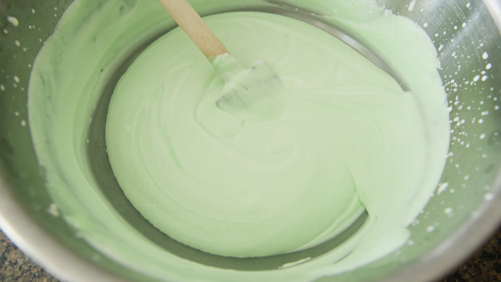 folding in chilled mint mixture into whipped cream