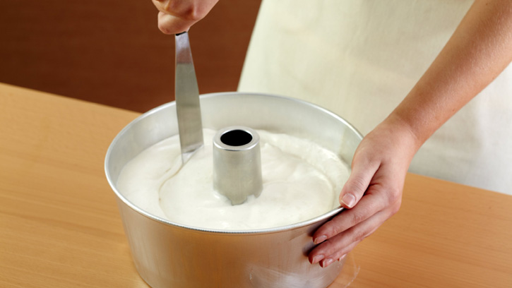cutting through batter with spatula