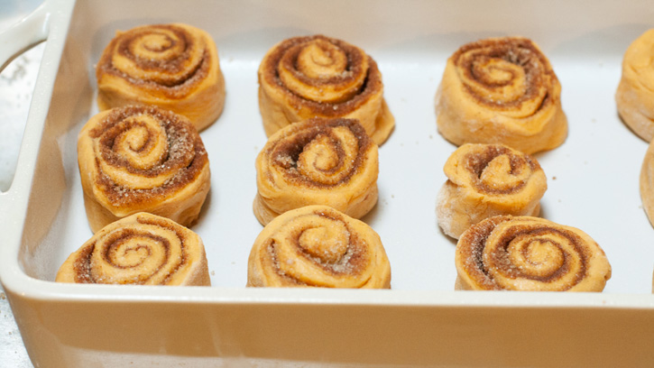 unbaked rolls in baking dish