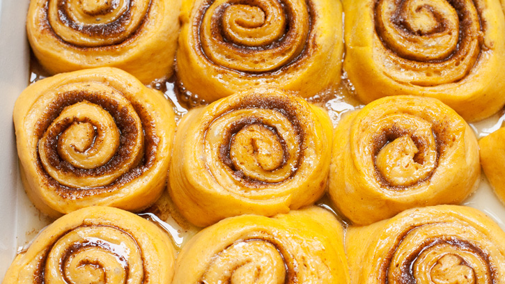 rolls raising in baking dish