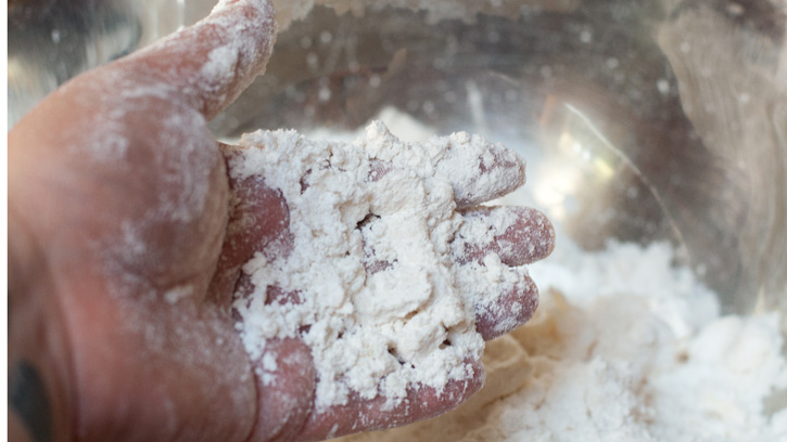 hand in flour bowl