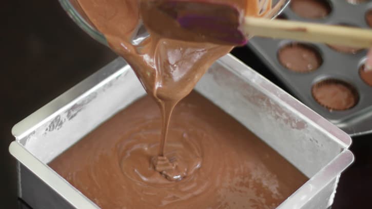 pouring batter into cake pan