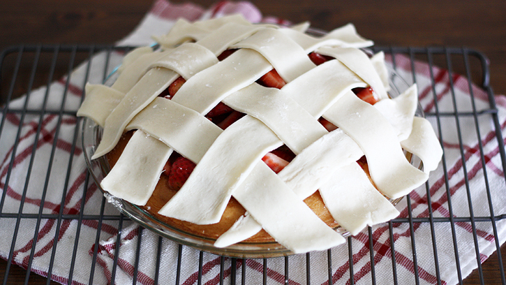 pie crust over cake and strawberries