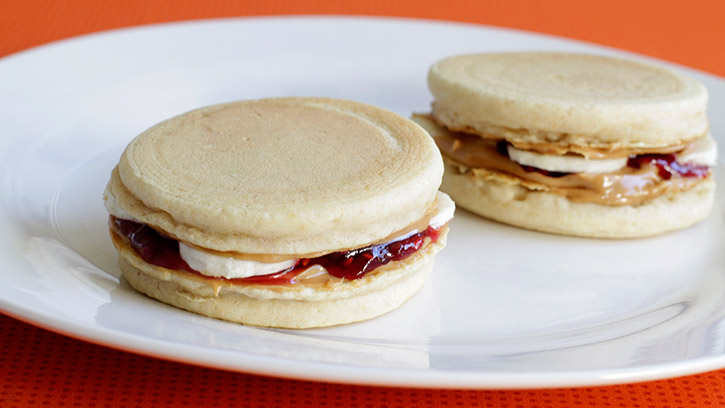Peanut butter, jelly and banana sliders on plate
