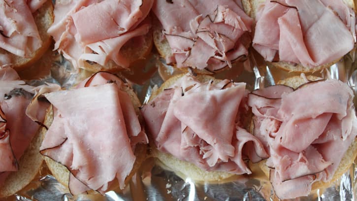 sandwich rolls topped with deli sliced ham