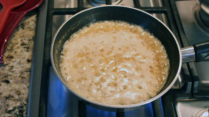 melting butter and onion in pan on stovetop