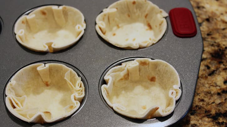 tortillas in muffin tin