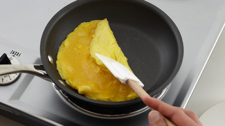 folding omelet in pan