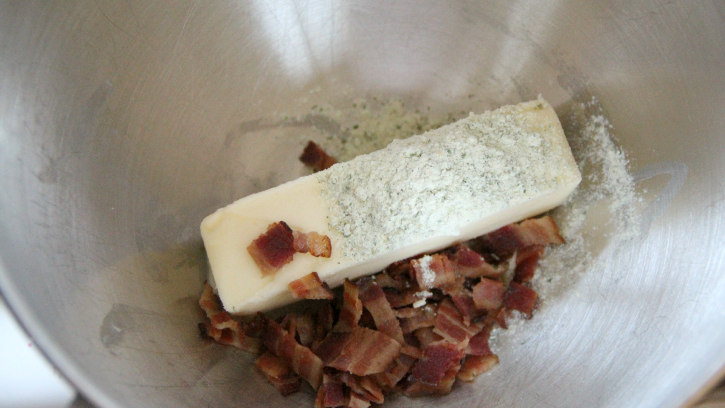 adding bacon pieces and ranch dressing mix to butter
