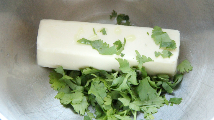 adding cilantro and lime juice to butter